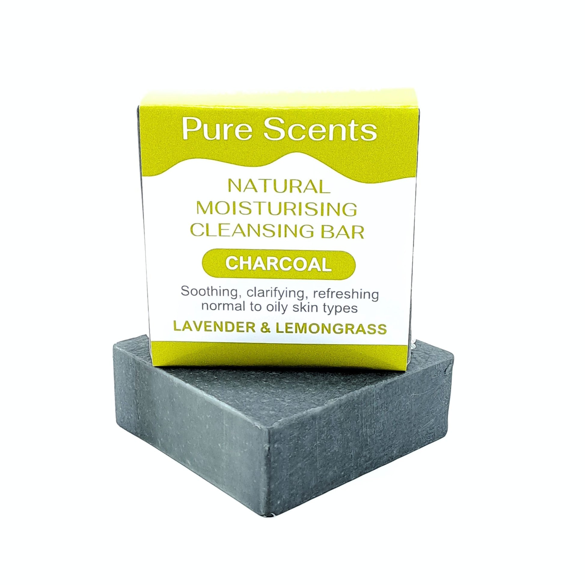 A charcoal goats milk soap bar with Lavender and lemongrass essential oils, displayed underneath another charcoal soap sitting on top with a olive green and white label.