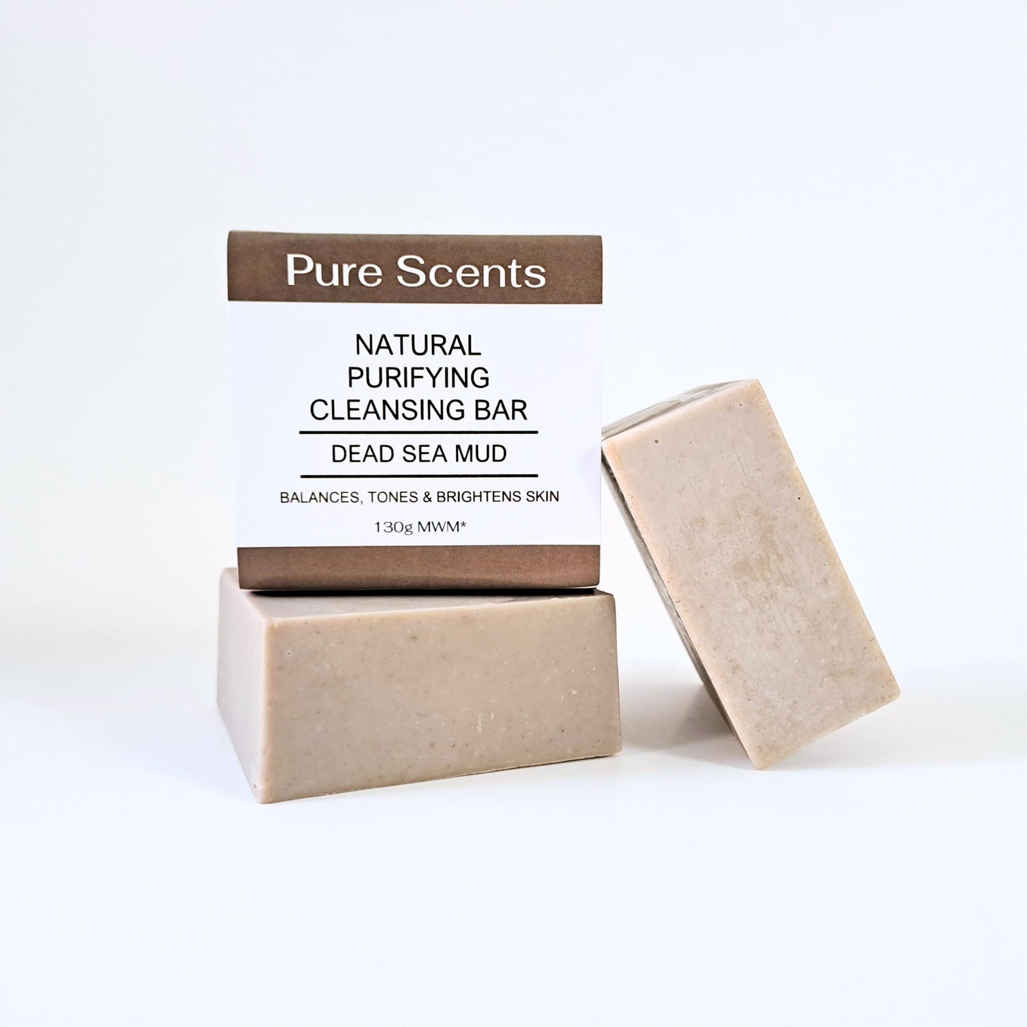 3 bars of Dead Sea Mud Soap sitting on a white background