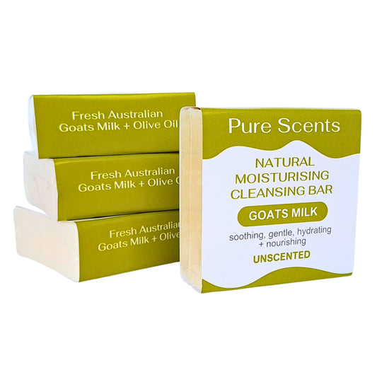 A set of four bars of fresh Australian goats' milk natural moisturising cleansing bar, unscented, stacked in a green and white packaging with the brand 'Pure Scents' written on it.